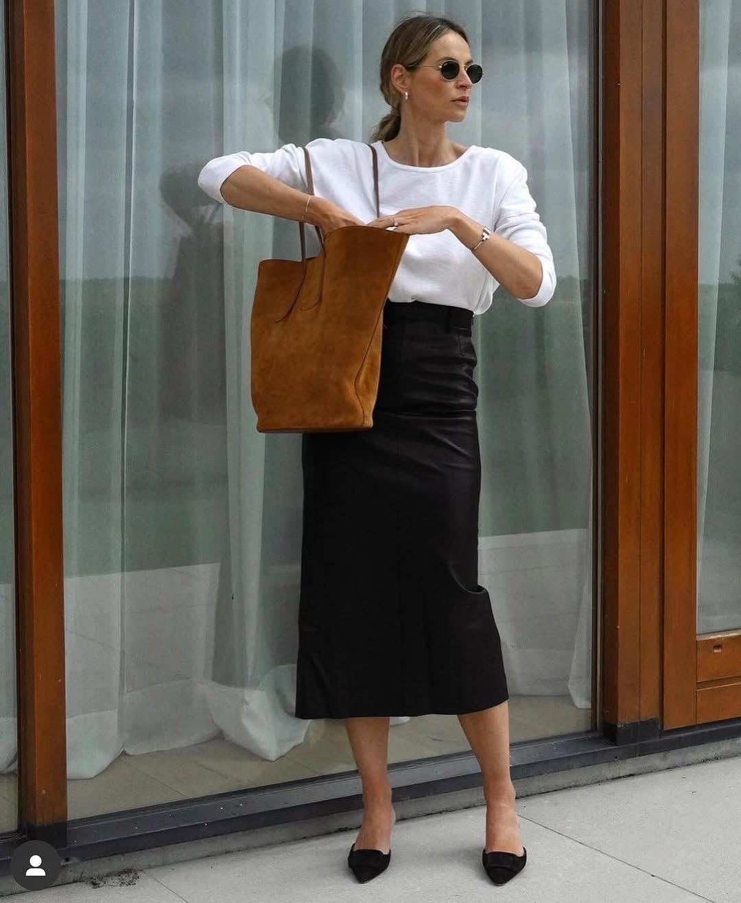 Chic black leather skirt with casual white top