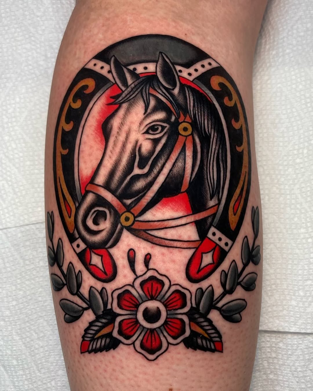 Stunning black and red horse tattoo design