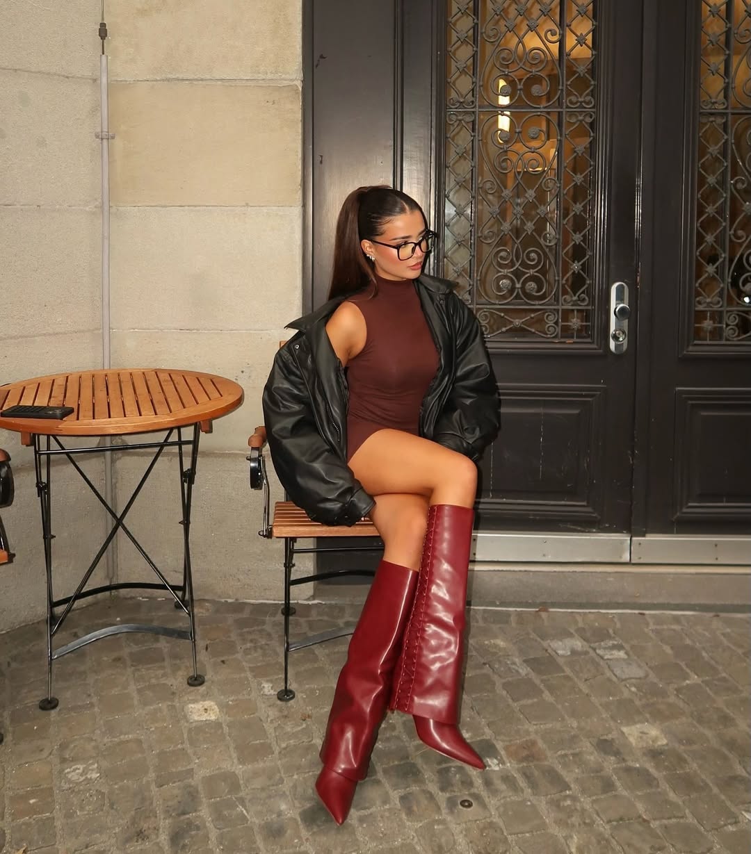 Chic red boots elevate a stylish outfit