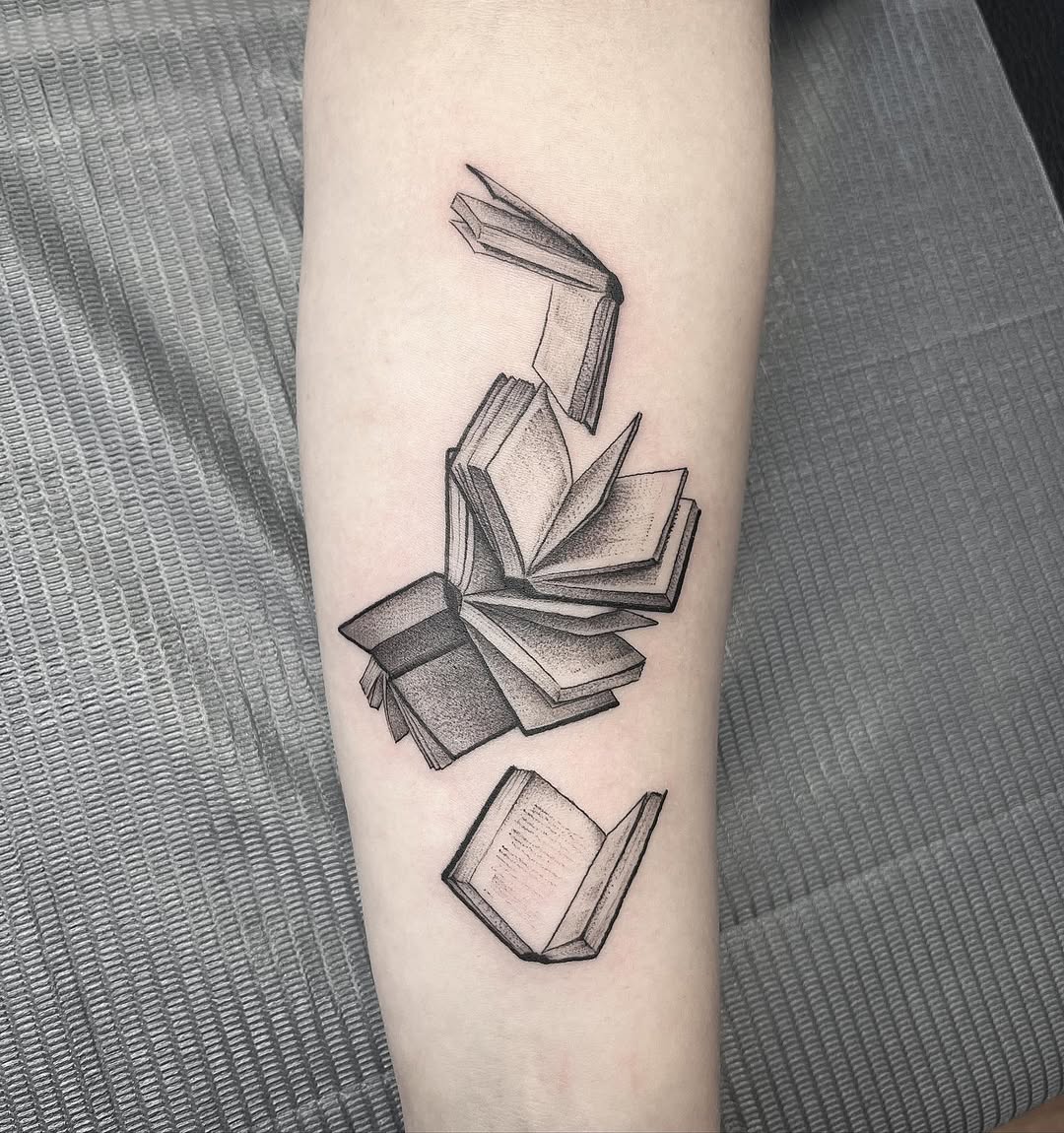 Intricate tattoo of an open book's pages