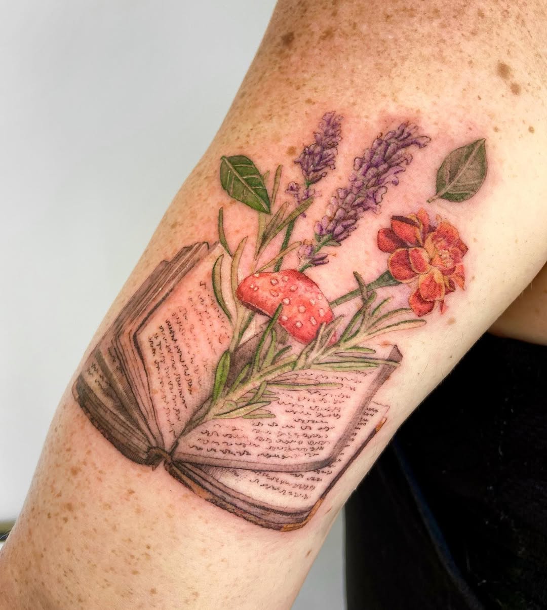 Whimsical floral book tattoo inspiration