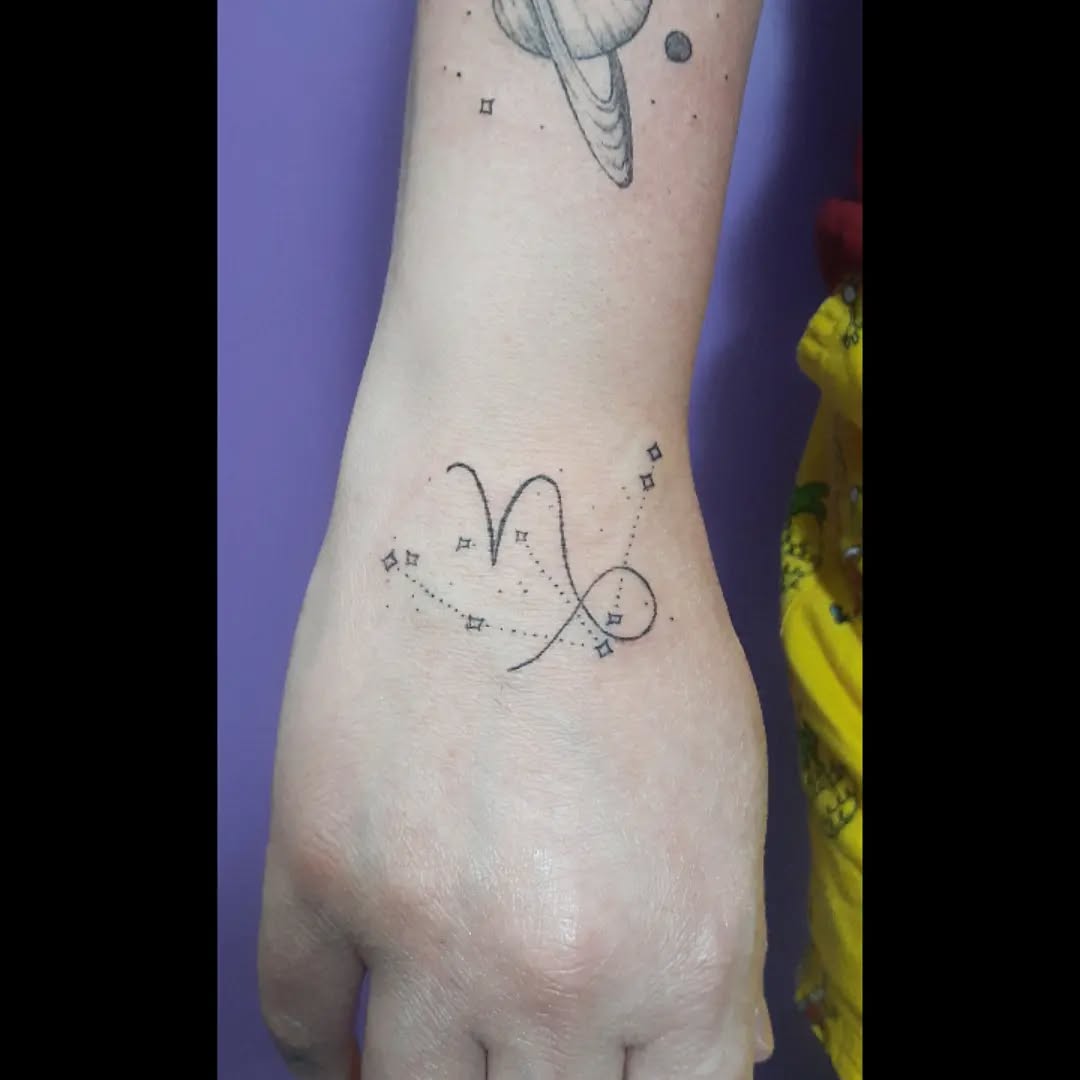 Elegant Capricorn constellation tattoo on wrist