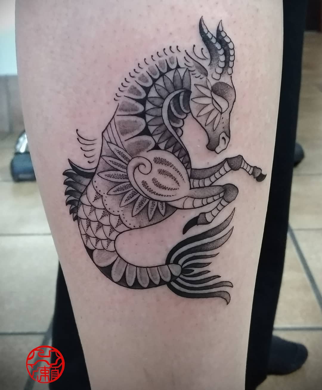 Stylized Capricorn Tattoo with Intricate Details