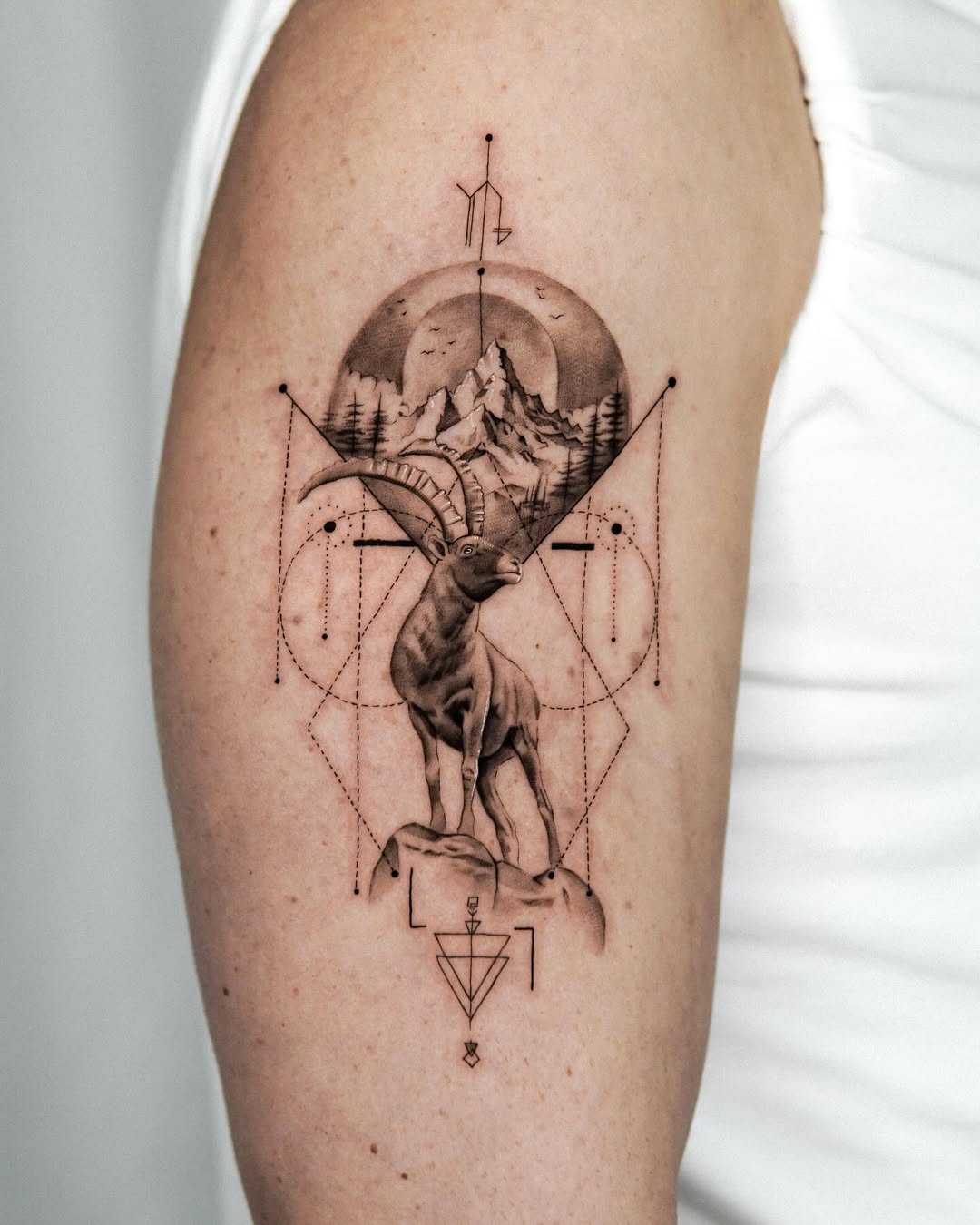 Elegant Capricorn Tattoo with Landscape Elements