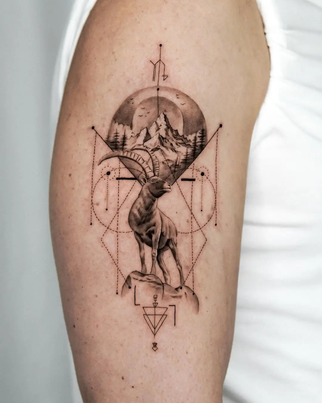 Elegant Capricorn Tattoo with Landscape Elements