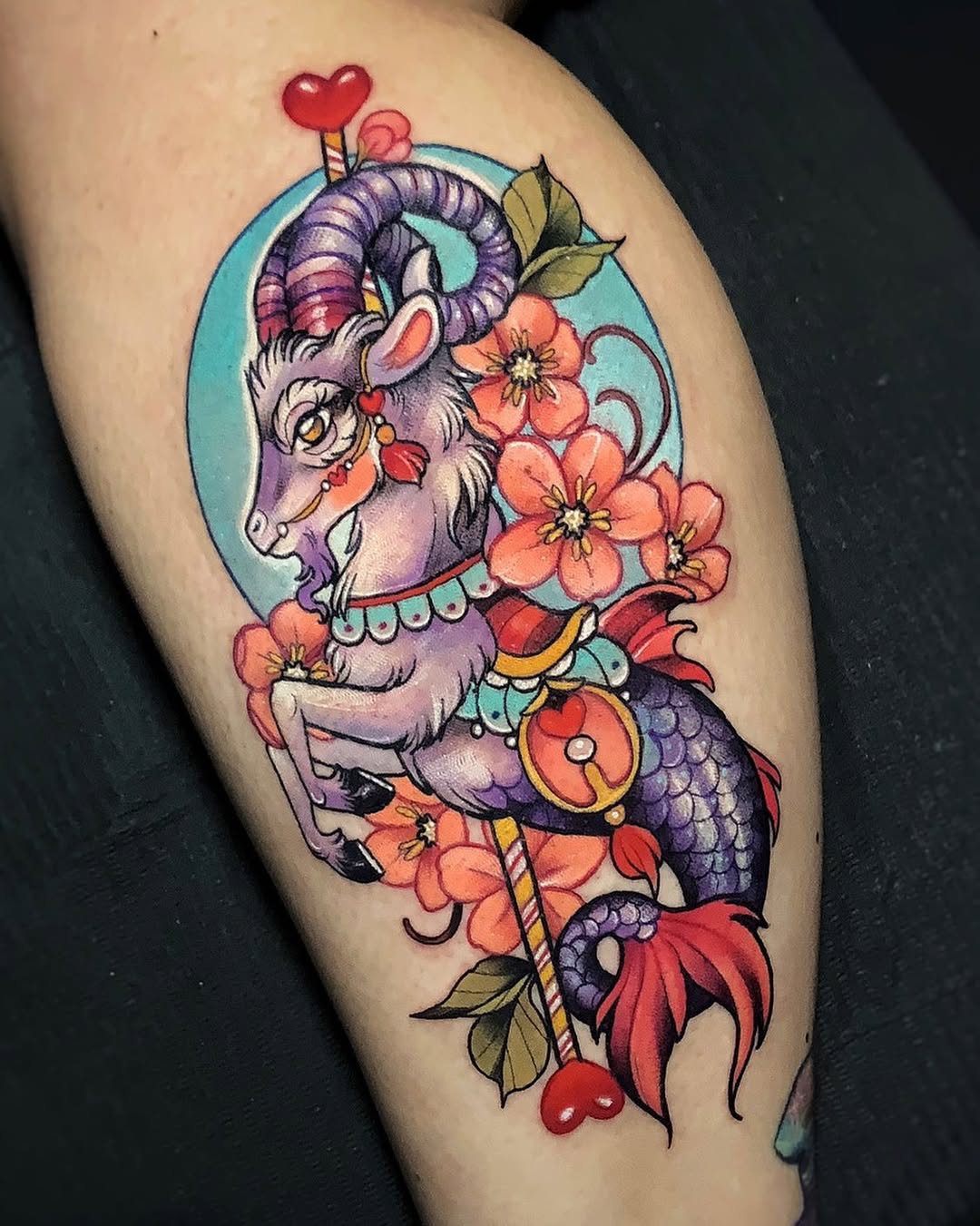 Vibrant Capricorn tattoo with floral elements