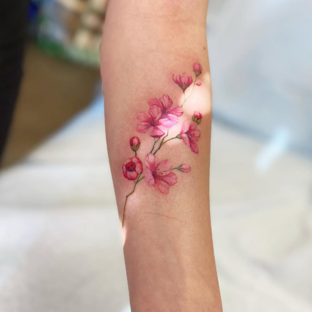 Delicate cherry blossoms gracing the forearm