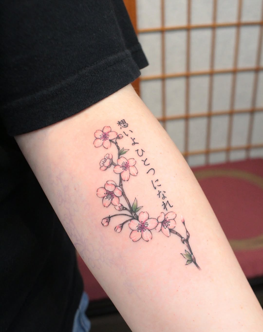 Stunning cherry blossom tattoo with Japanese text