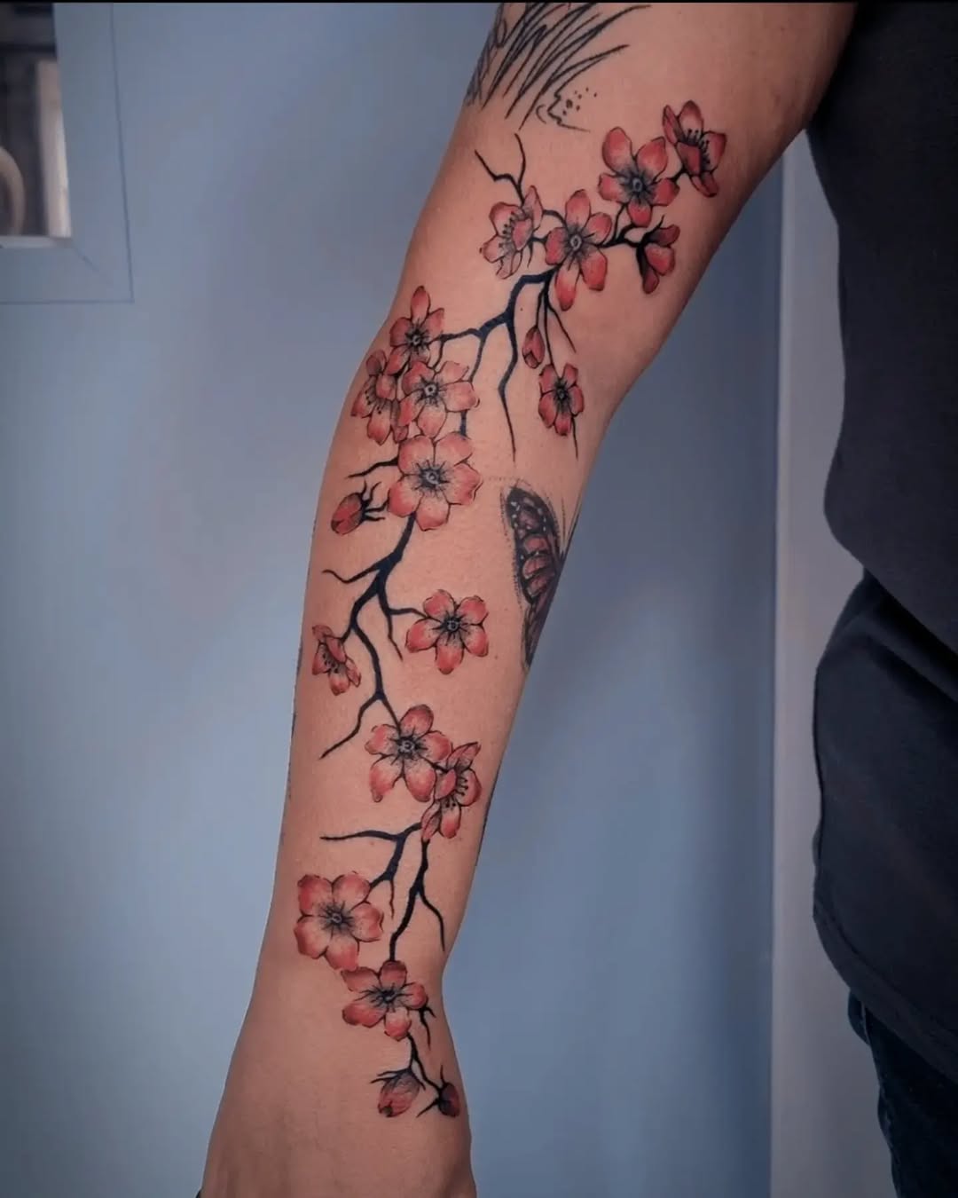 Stunning cherry blossom tattoo on the forearm