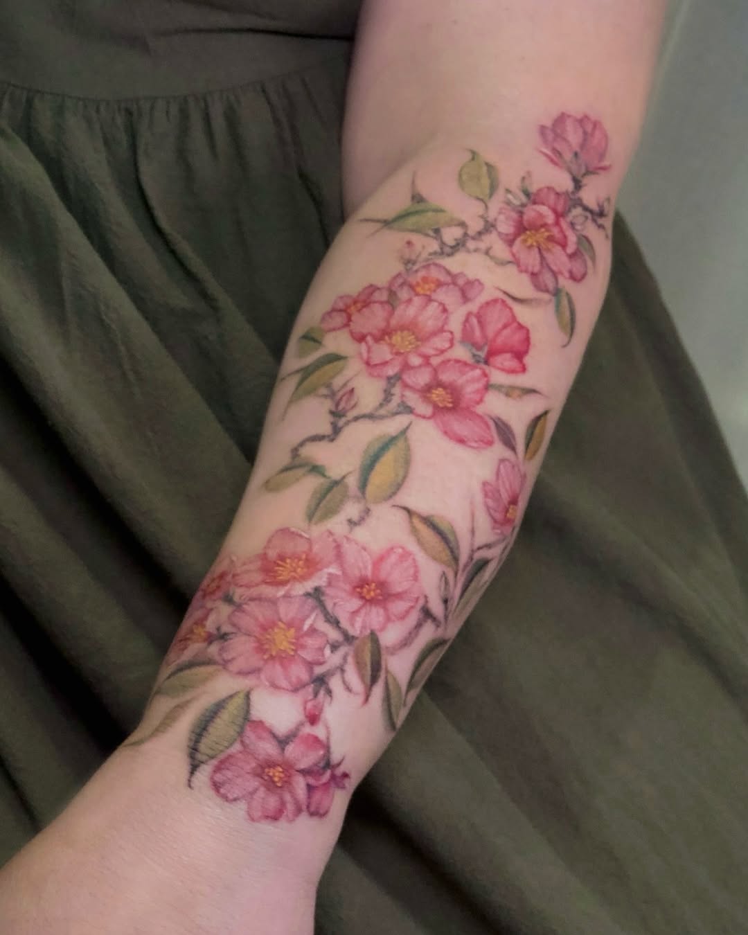 Vibrant Cherry Blossom Tattoo on Arm