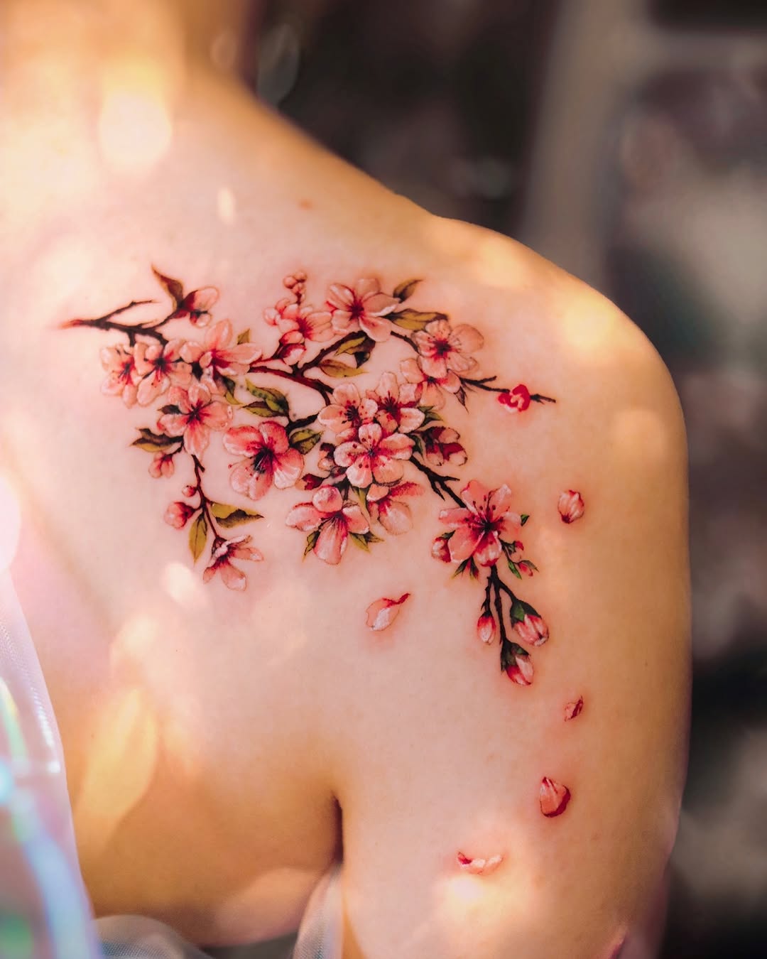 Stunning cherry blossom tattoo on shoulder