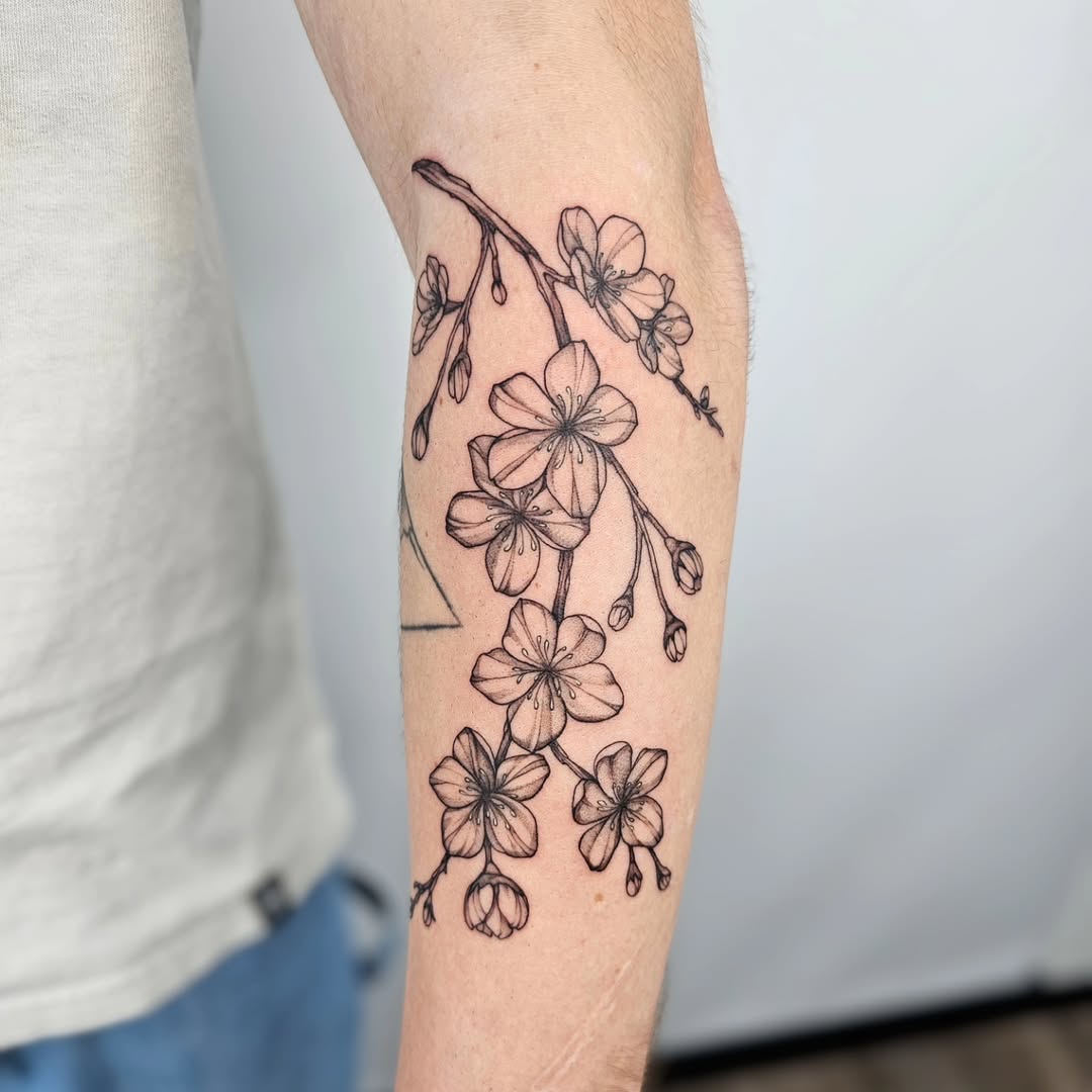 Elegant cherry blossom tattoo design inspiration