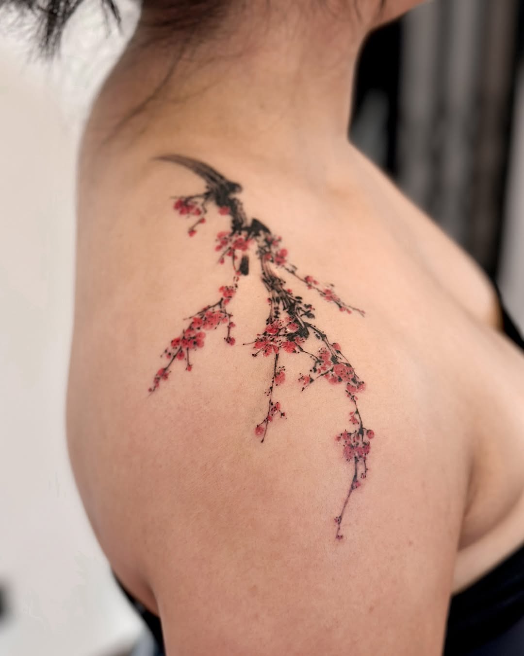 Stunning cherry blossom tattoo on shoulder