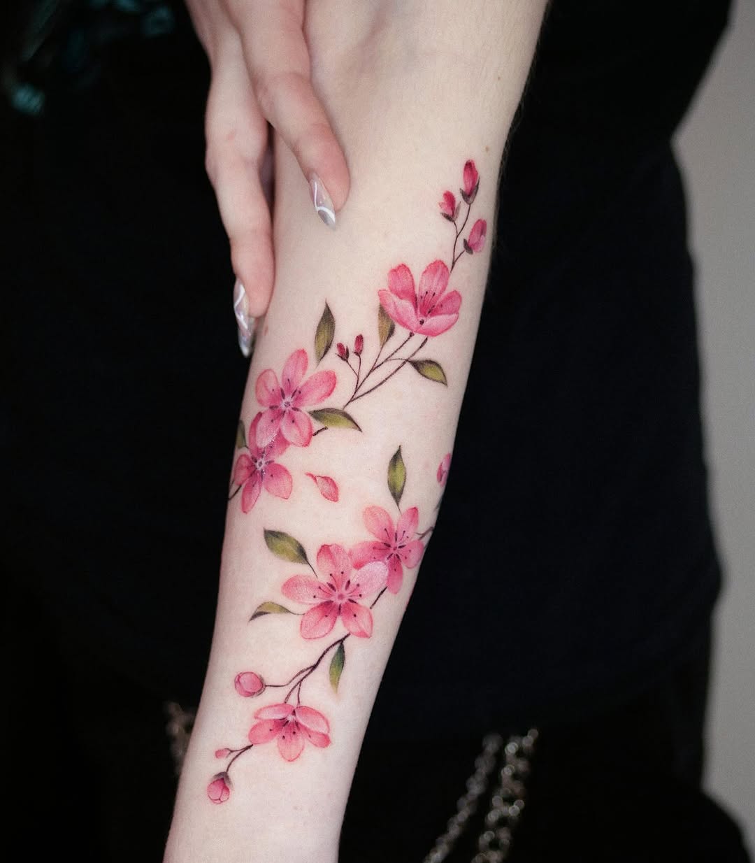 Elegant cherry blossom design on bare skin