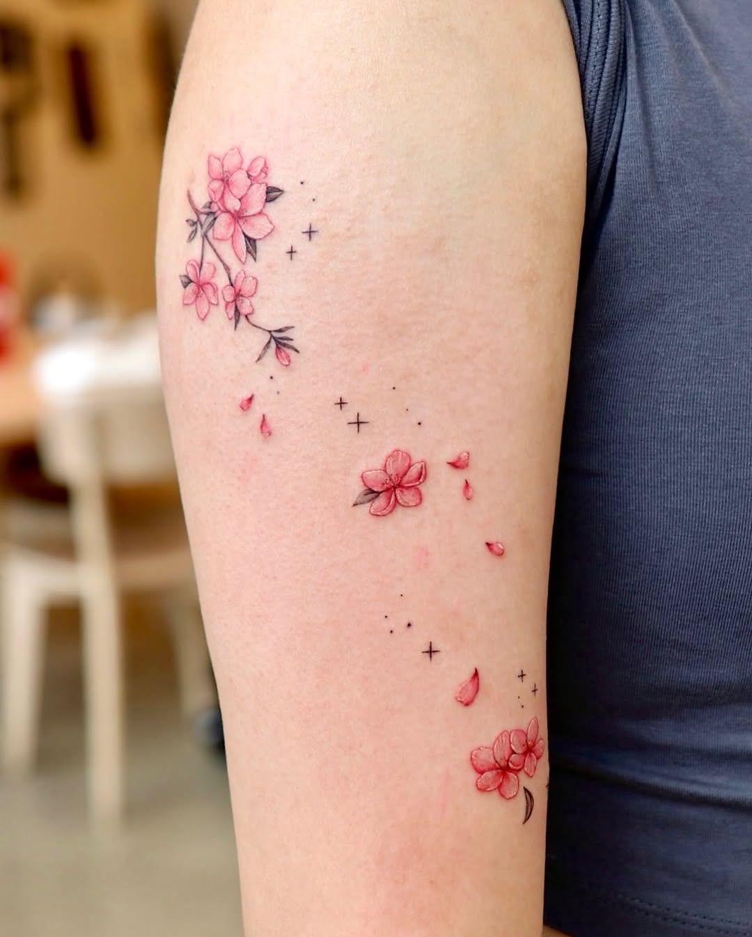 Serene cherry blossom tattoo with delicate petals