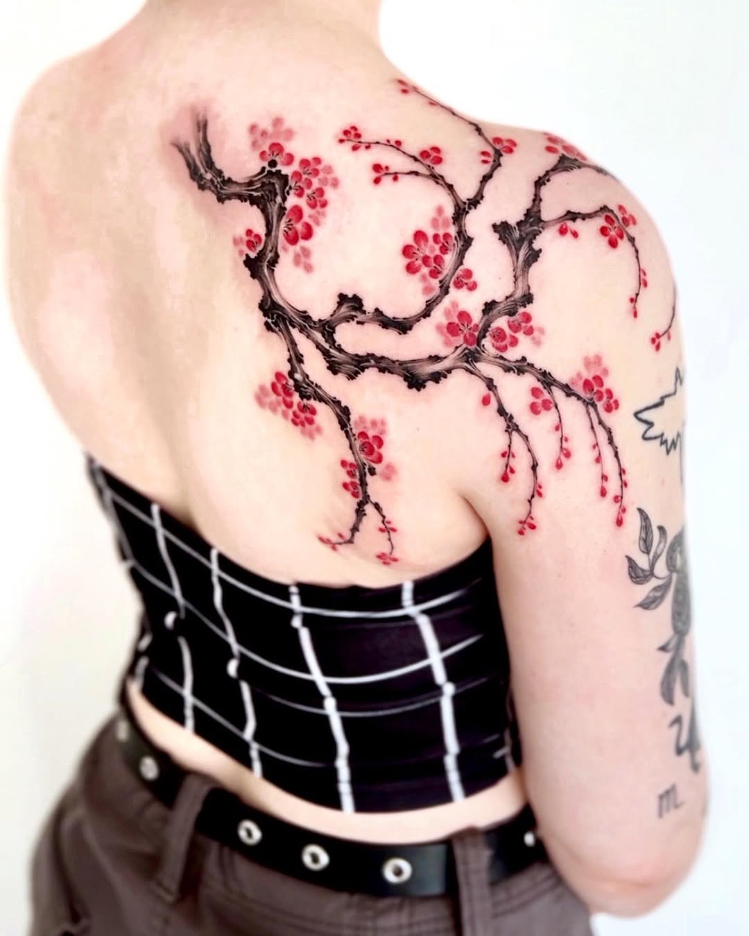 Stunning cherry blossom tattoo on the back