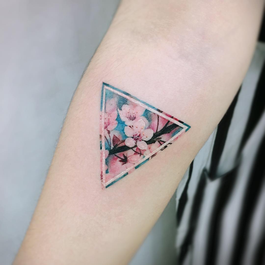 Stylish triangle cherry blossom tattoo design