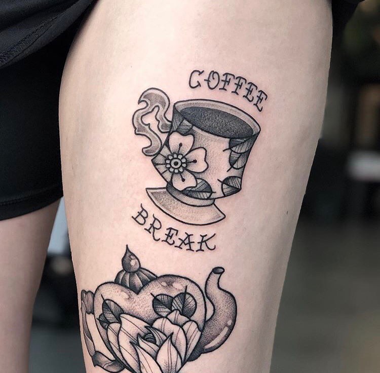 Charming coffee cup tattoo design with flowers