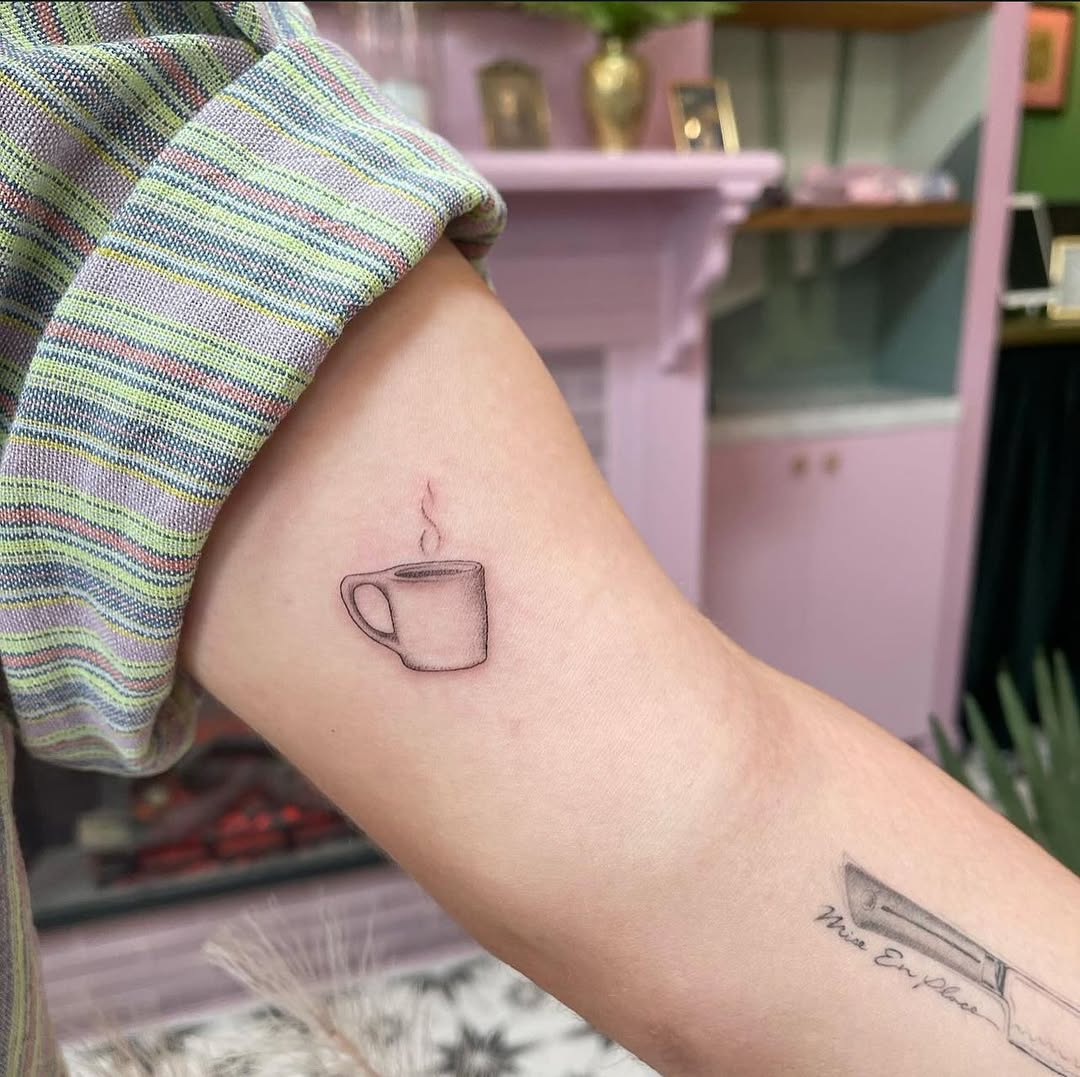 Charming minimalist coffee cup tattoo design