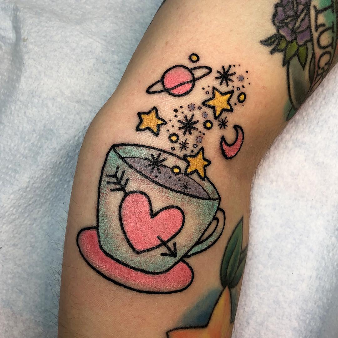 Whimsical coffee cup with cosmic elements