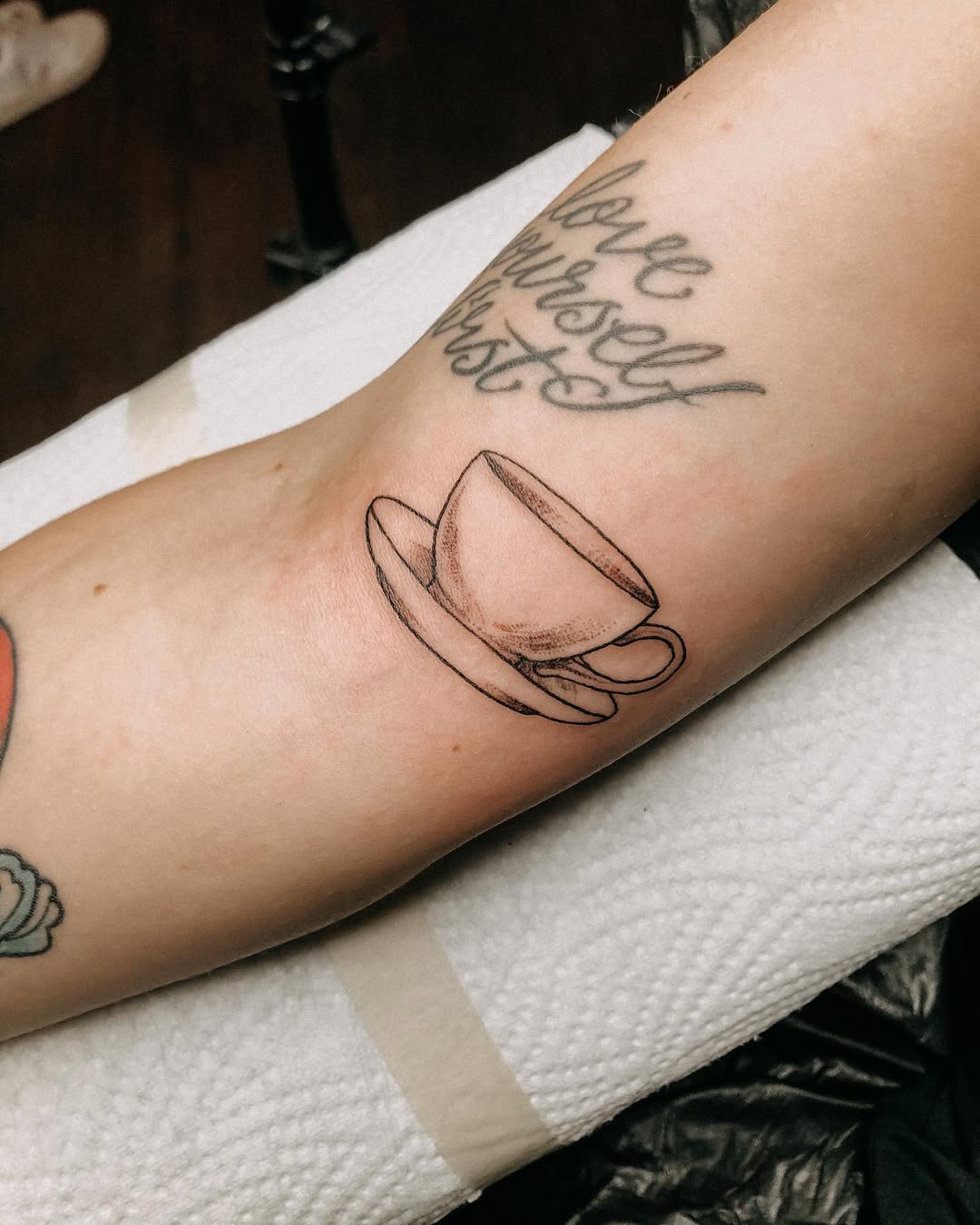 Charming minimalist coffee cup tattoo design