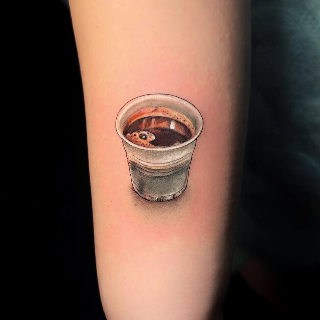 A stunning tattoo of a coffee cup