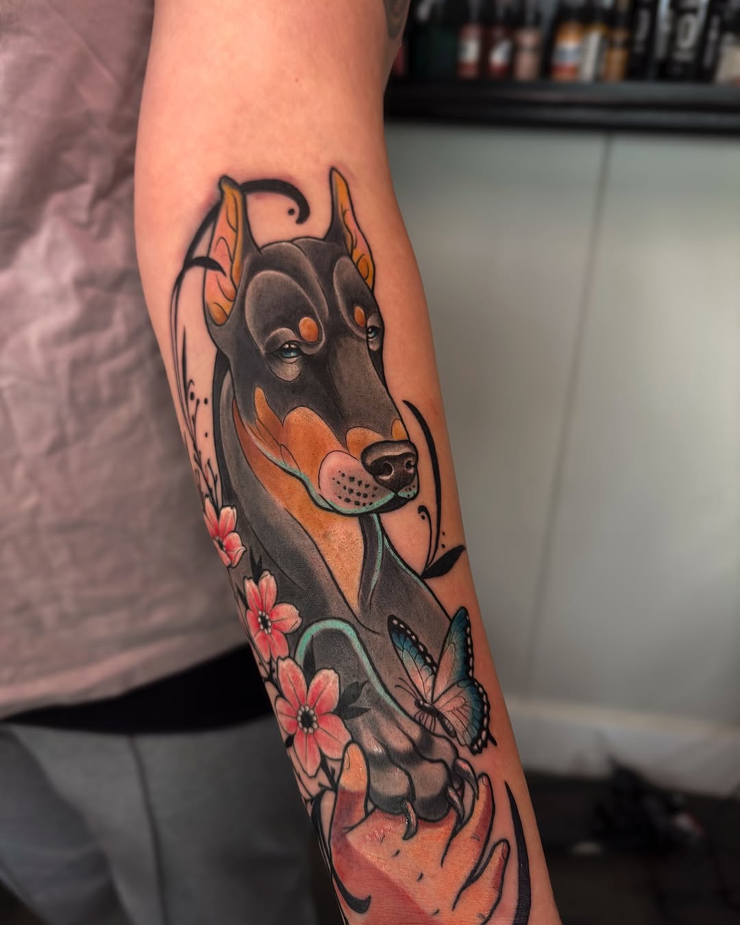 Colorful Doberman Tattoo with Floral Elements