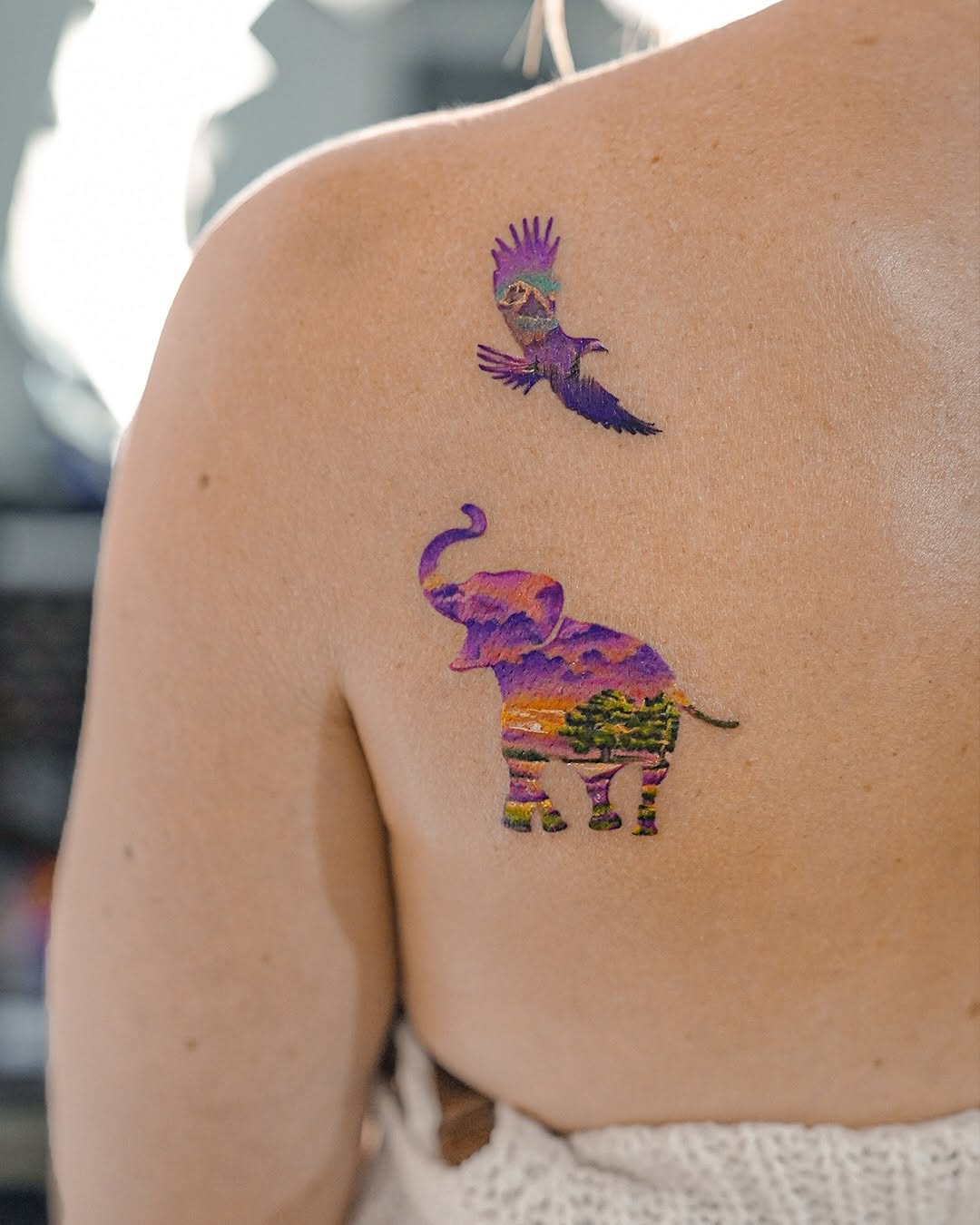 Vibrant Elephant and Bird Tattoo Design