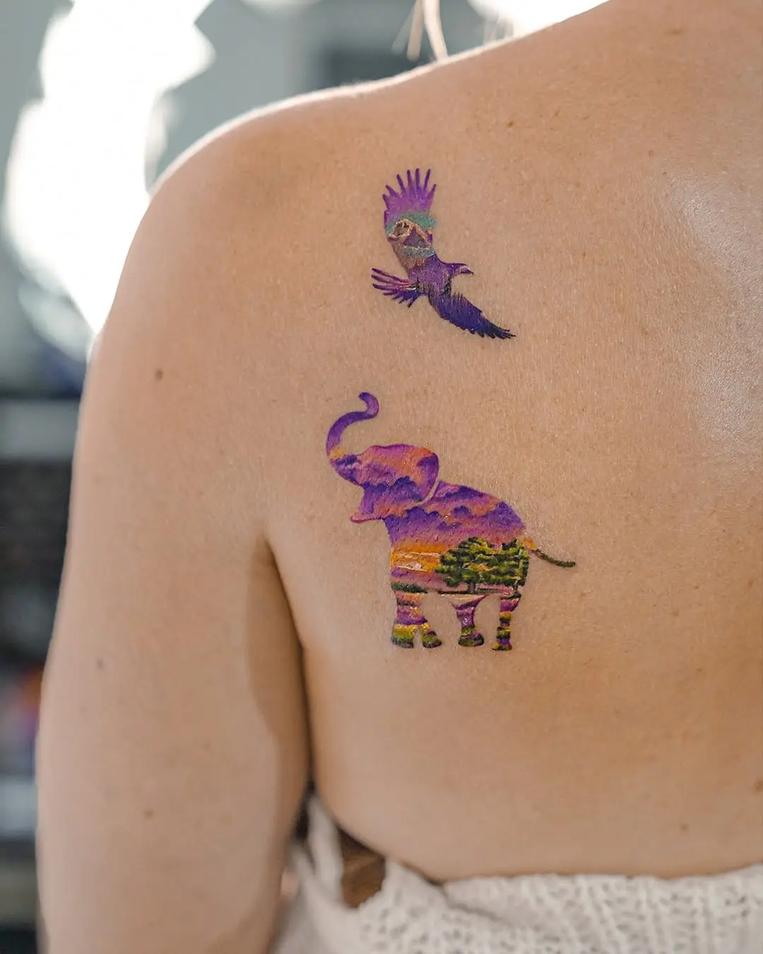 Vibrant Elephant and Bird Tattoo Design
