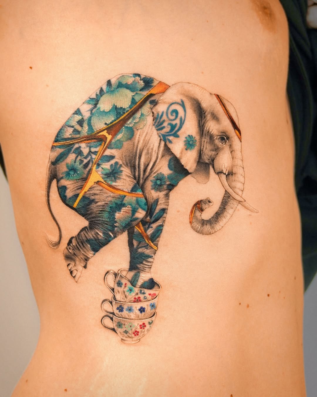 Unique elephant tattoo with floral patterns