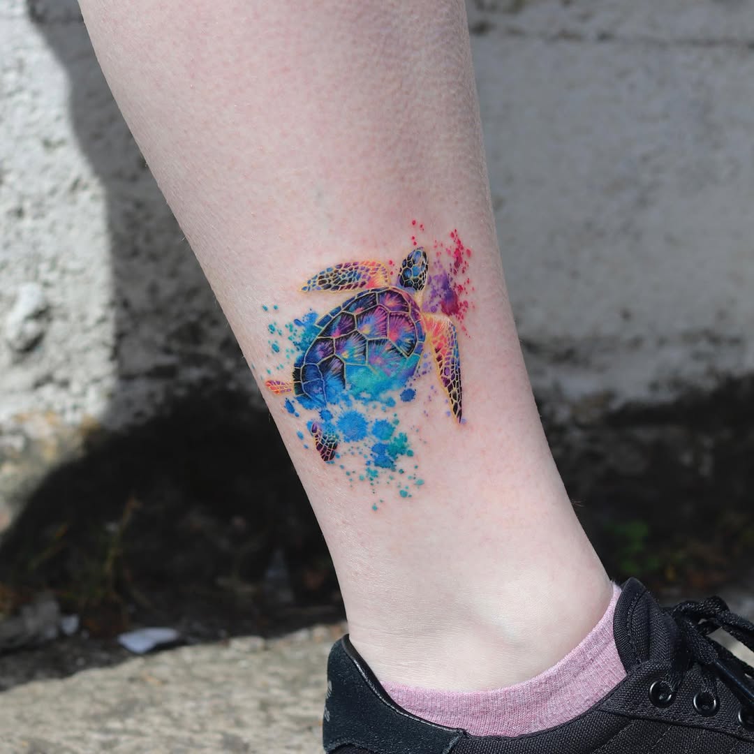 Colorful sea turtle tattoo with splash effects