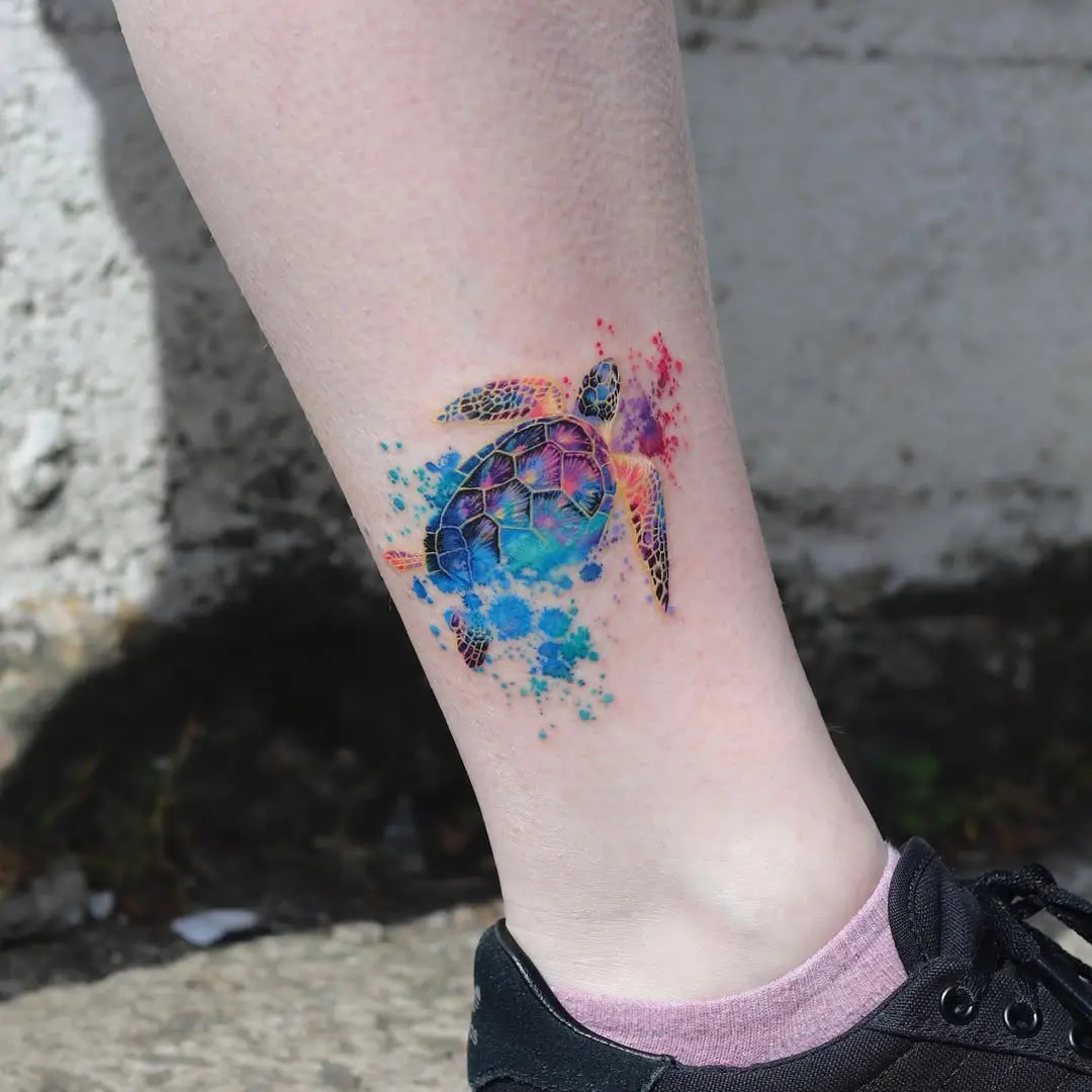 Colorful sea turtle tattoo with splash effects