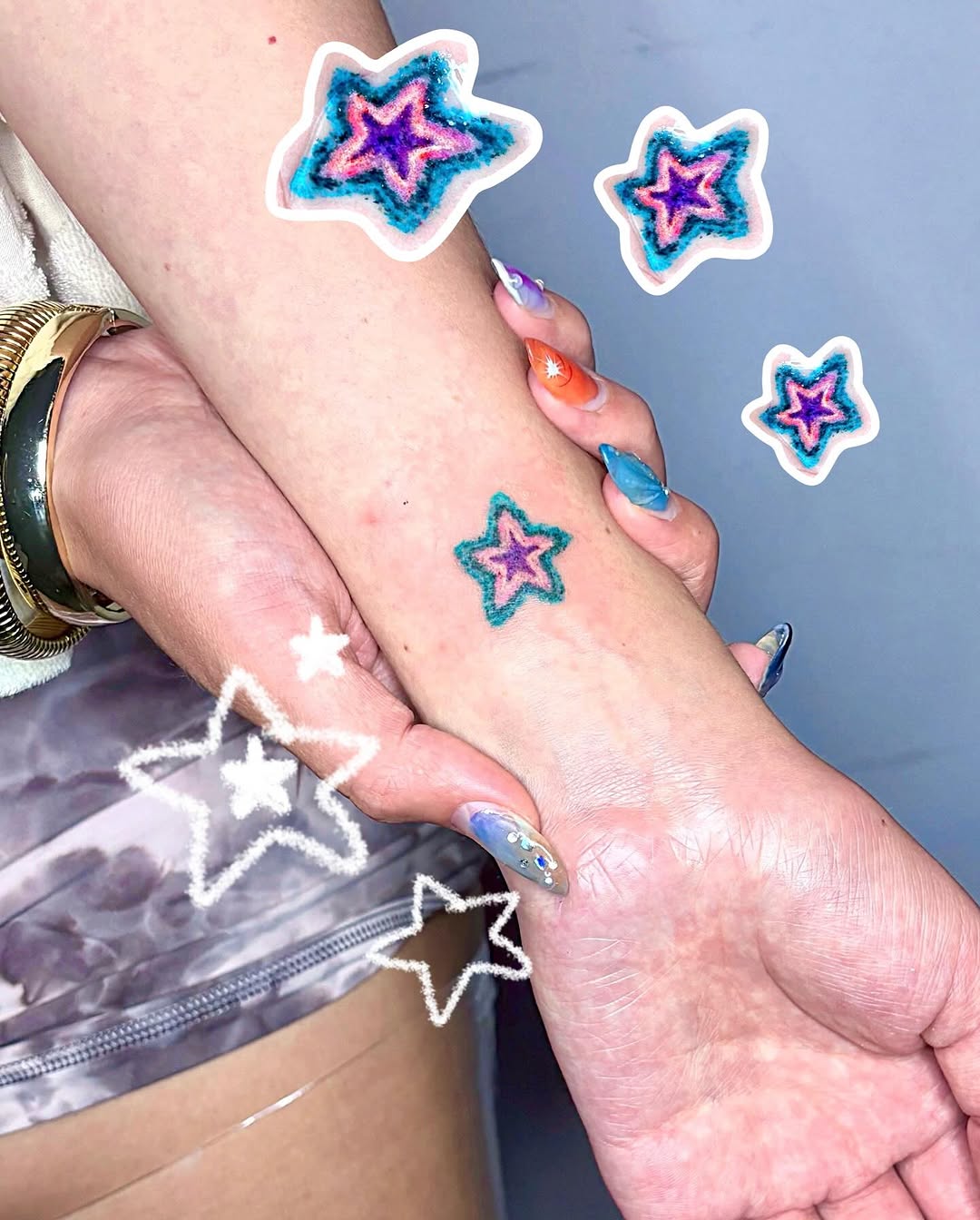 Vibrant star tattoo on a stylish wrist