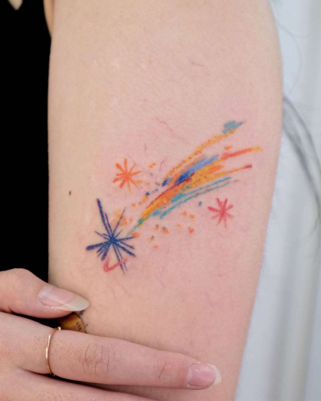 Vibrant and whimsical star tattoo design