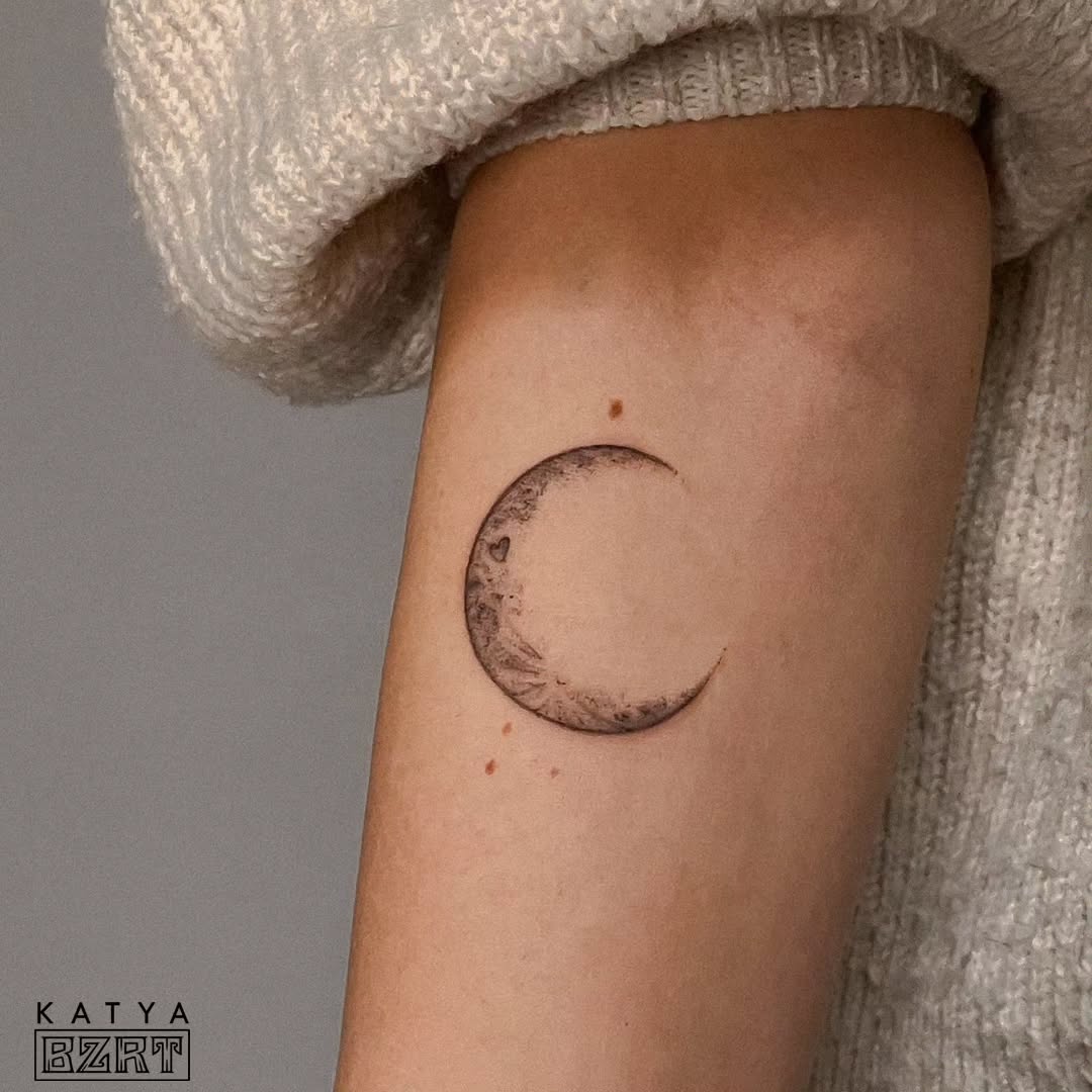 Intricate Crescent Moon Tattoo on Arm