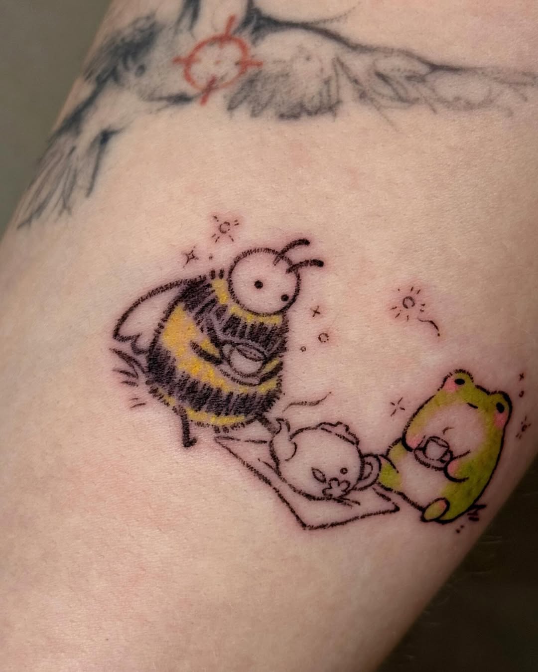 Charming cartoon bee and frog tattoo design