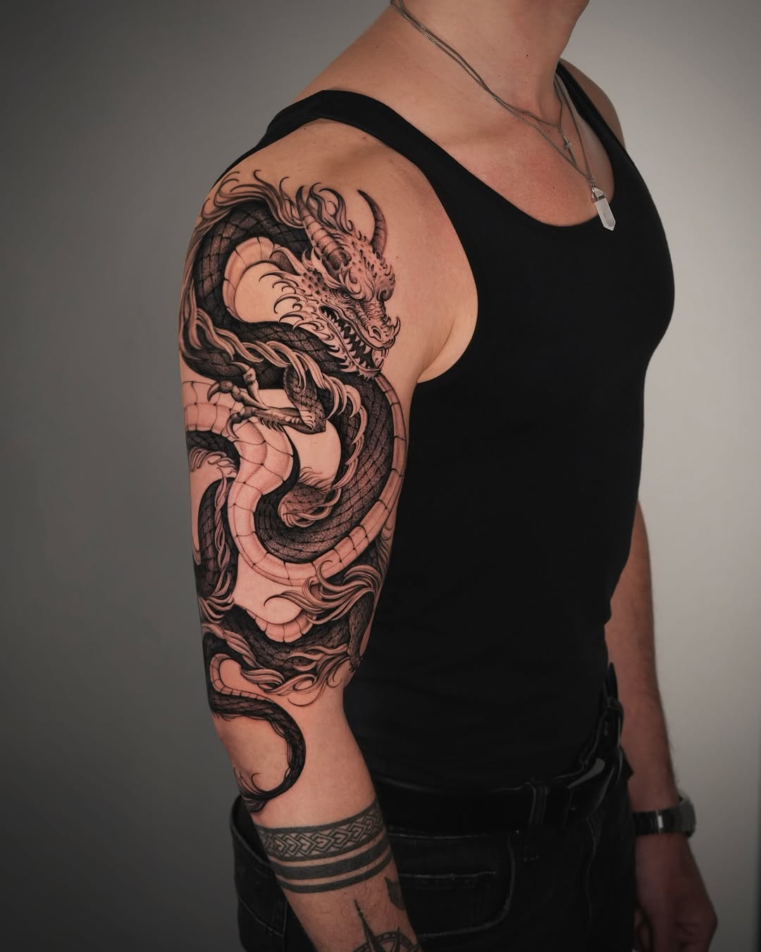 Striking Dragon Tattoo Wrapping Around Arm