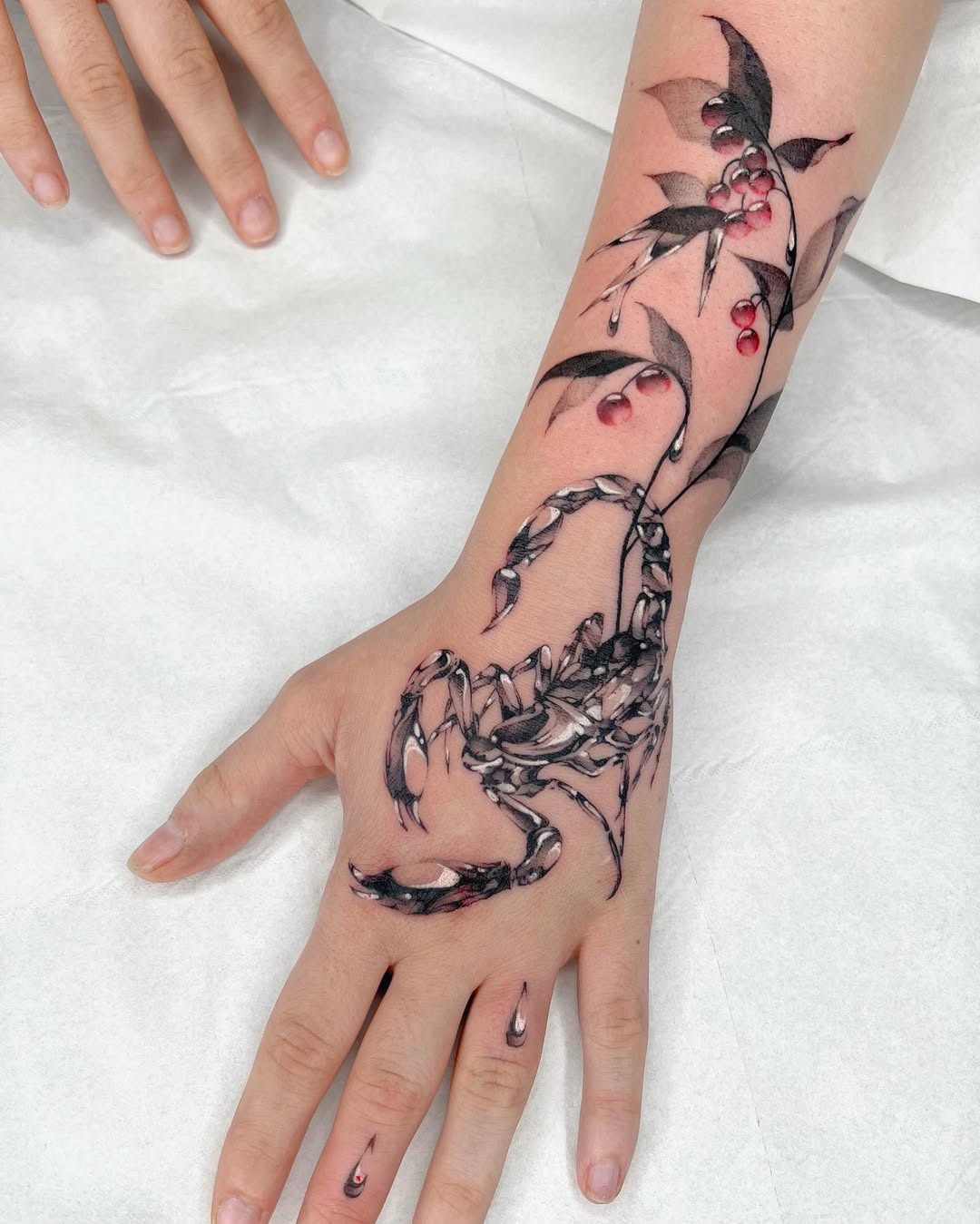 Intricate scorpion tattoo combined with floral designs