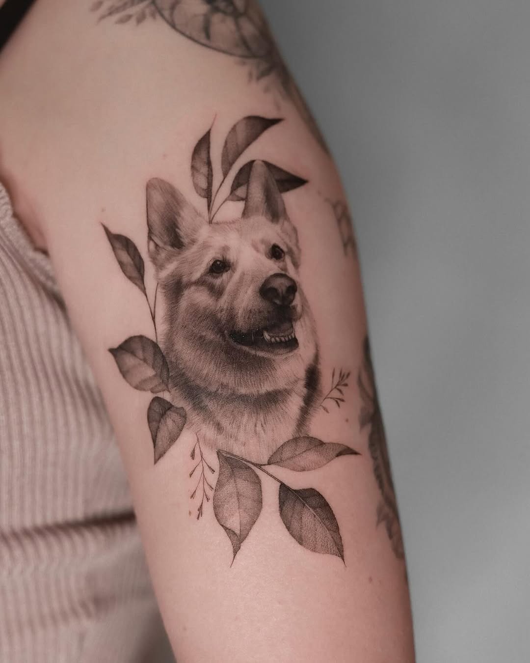 Exquisite Dog Tattoo Surrounded by Leaves