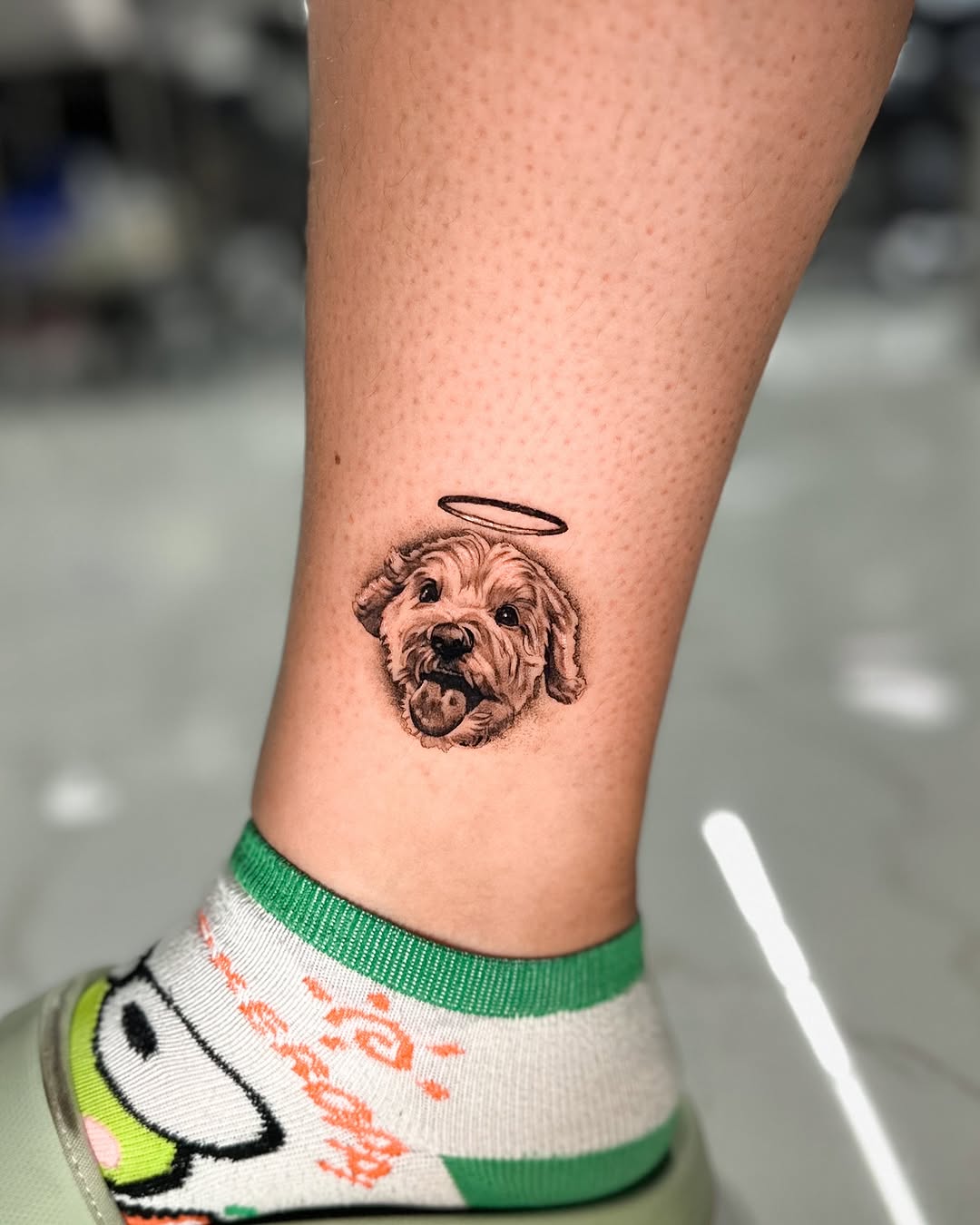 Charming dog tattoo with an angelic touch