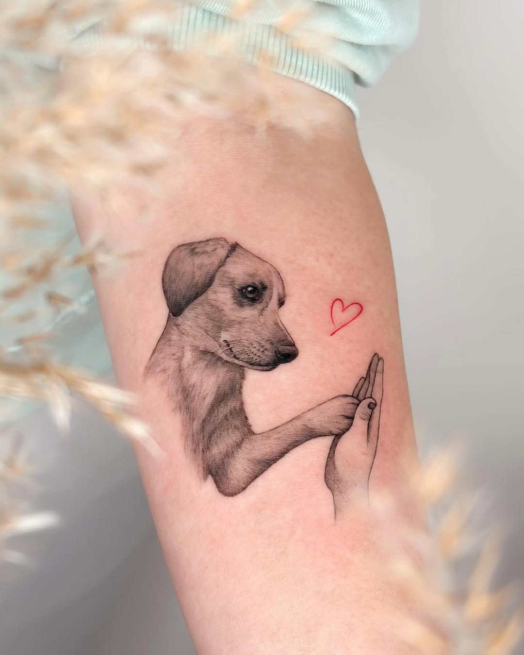 Beautiful dog and hand tattoo design