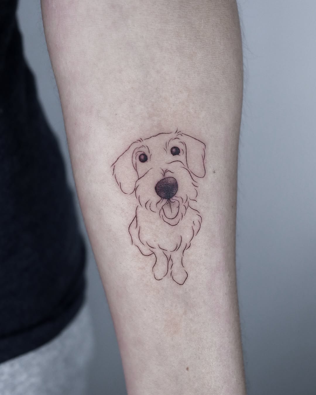 Charming dog tattoo brings joy and warmth