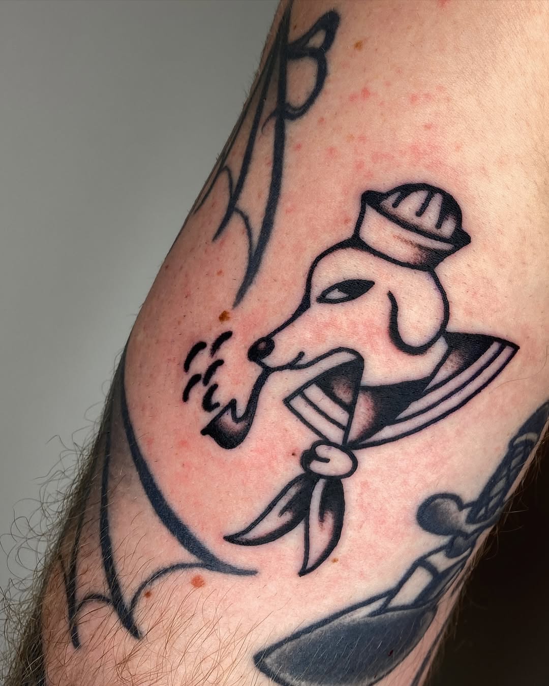 Sailor Dog Tattoo with a Playful Twist