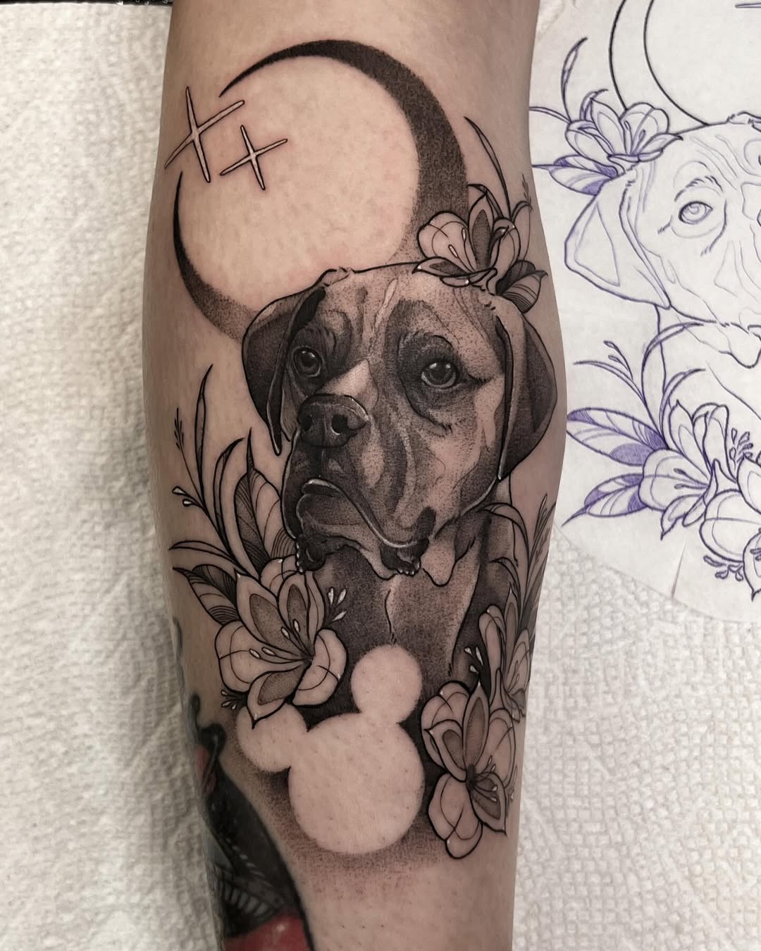 Elegant Dog Tattoo with Floral Accompaniments