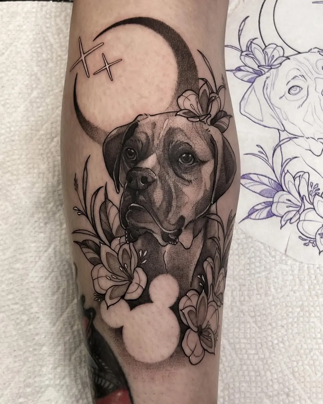 Elegant Dog Tattoo with Floral Accompaniments