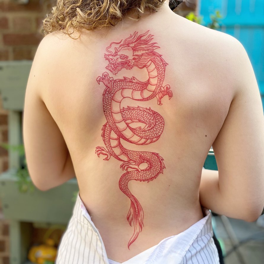 Stunning dragon tattoo in vibrant red ink