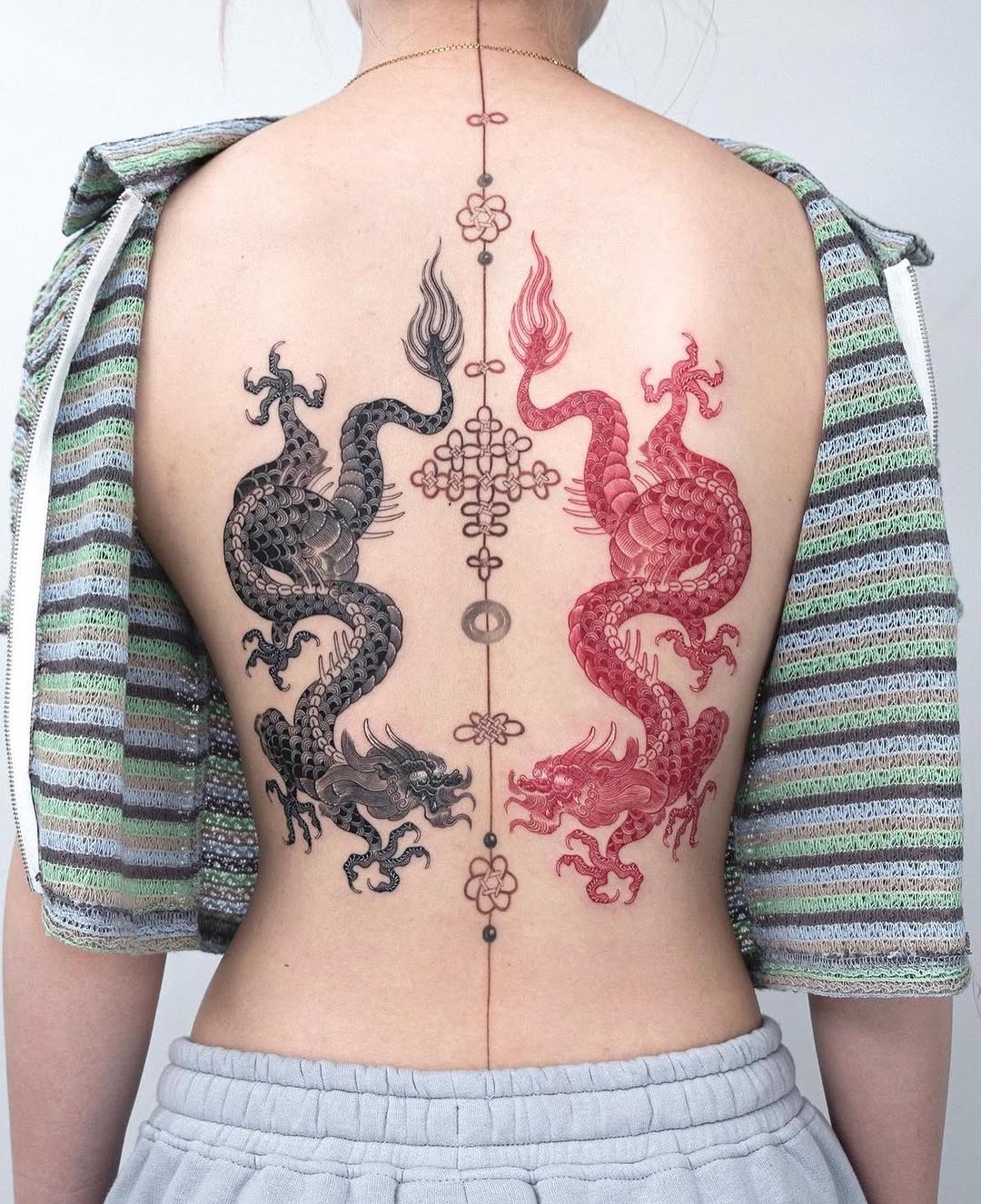 Stunning symmetrical dragon tattoo design on back