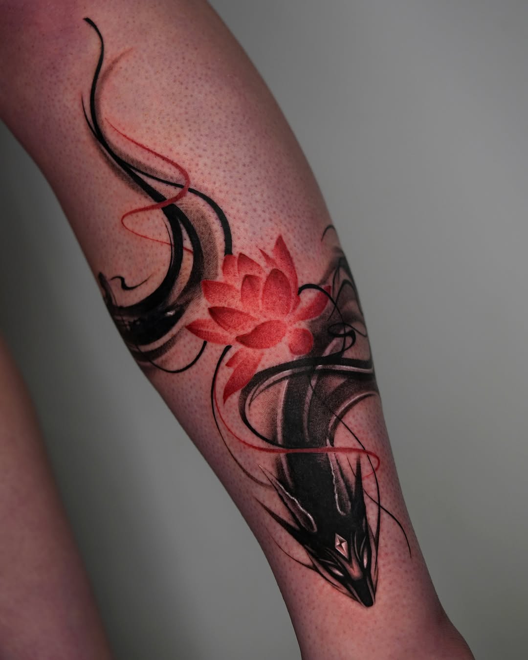 Striking Dragon Tattoo with Lotus Flower Design