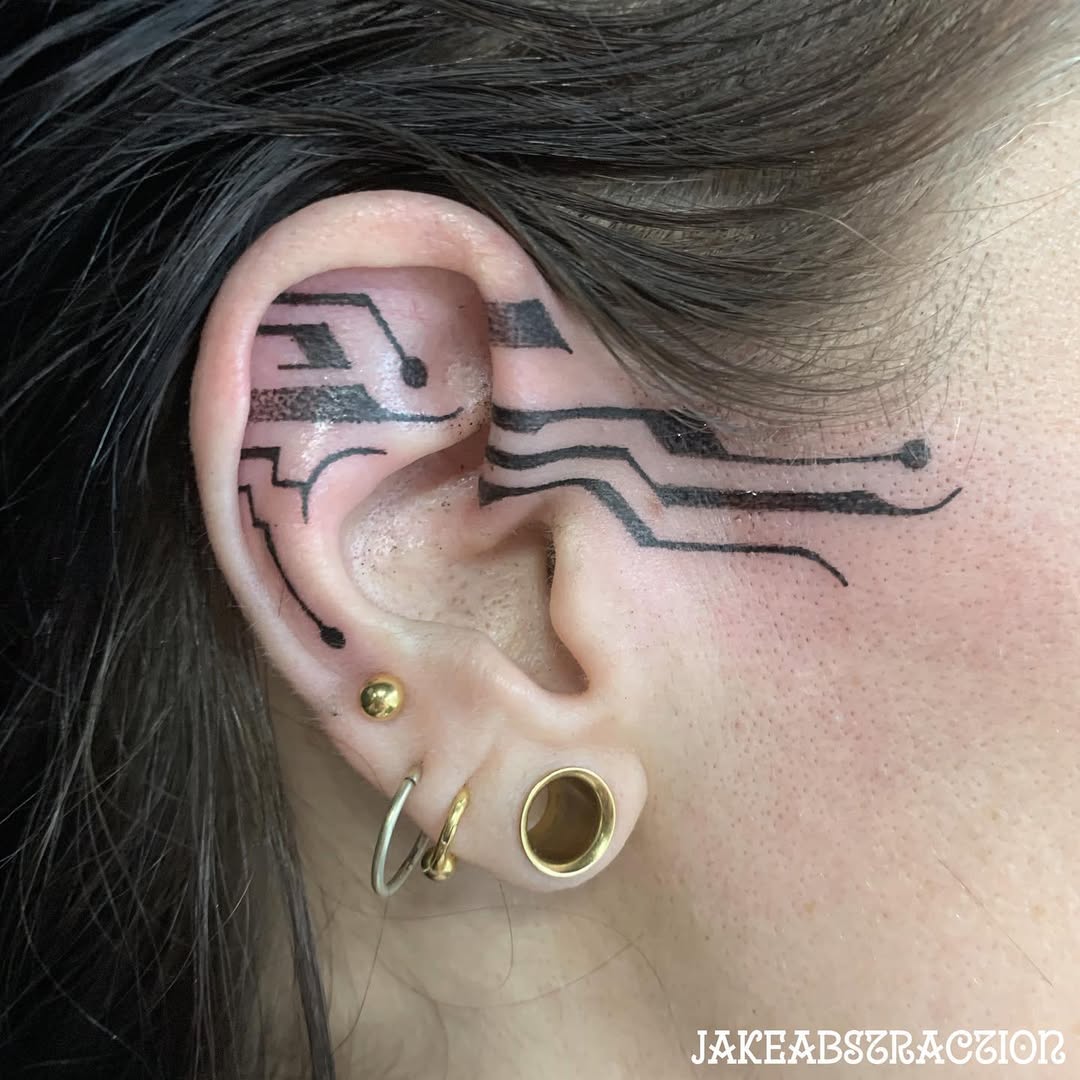 Abstract geometric ear tattoo with clean lines