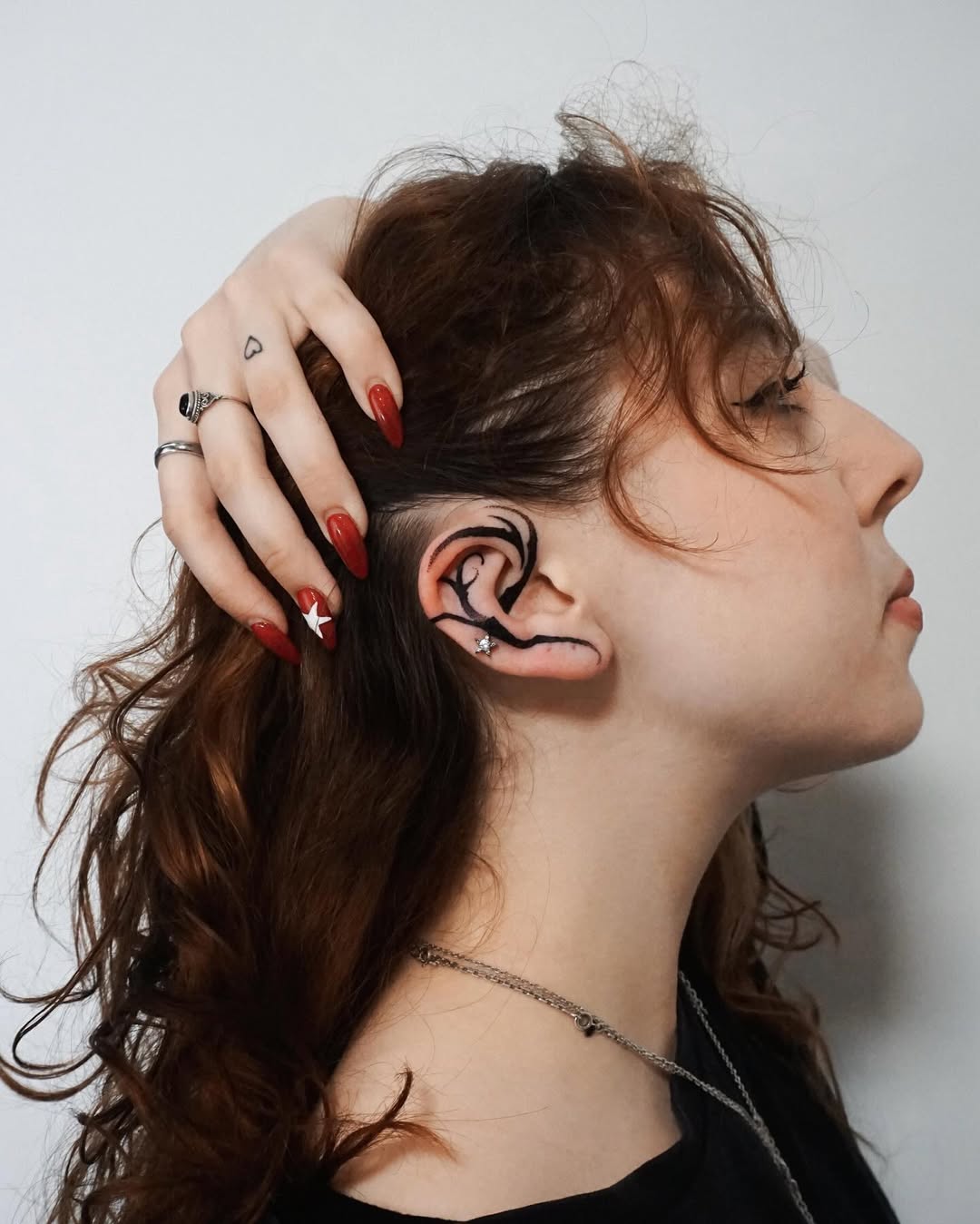 Minimalist ear tattoo for subtle elegance